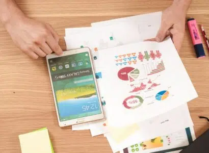 person holding white Samsung Galaxy Tab