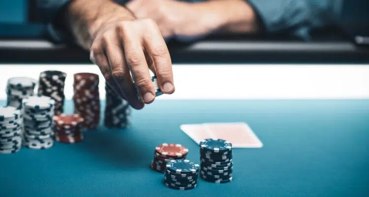 Successful player betting chips at casino