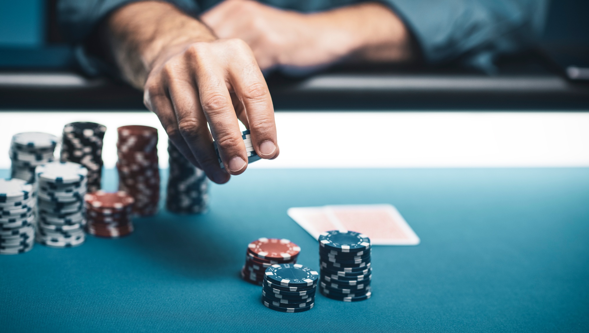 Successful player betting chips at casino