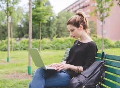 Young woman using computer remote working